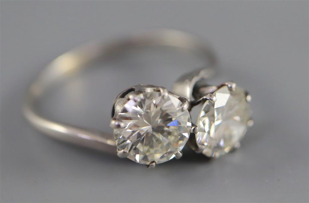 A platinum? and two stone diamond crossover ring,